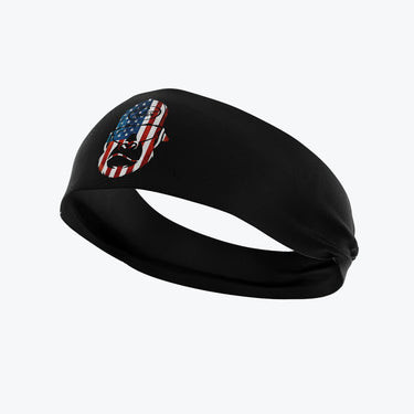 Moisture-wicking black Tater Kong headband featuring a stylized USA flag patch, designed for baseball training and workout sessions to keep players cool and focused.