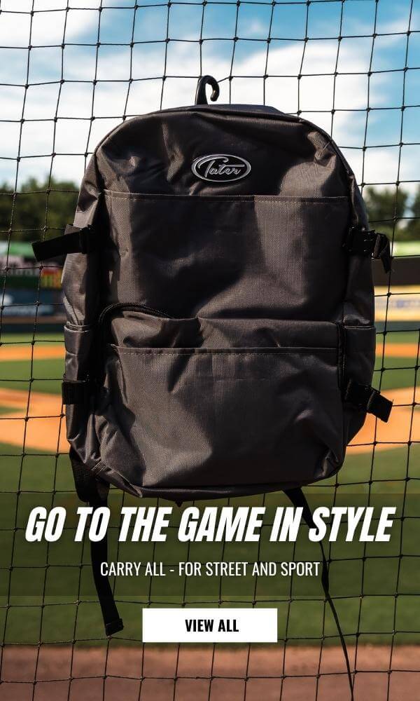 Minimalistic baseball coaches back pack hanging from fence. 