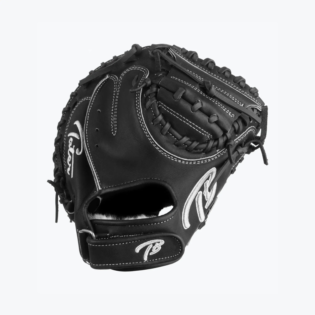 The image captures a Tater Baseball 28-inch Mini Catcher&#39;s Mitt Trainer, designed in classic black with stylish white stitching and logo detail. Its small pocket is perfect for training catchers to secure and handle the ball with precision. Ideal for refining skills on the field.