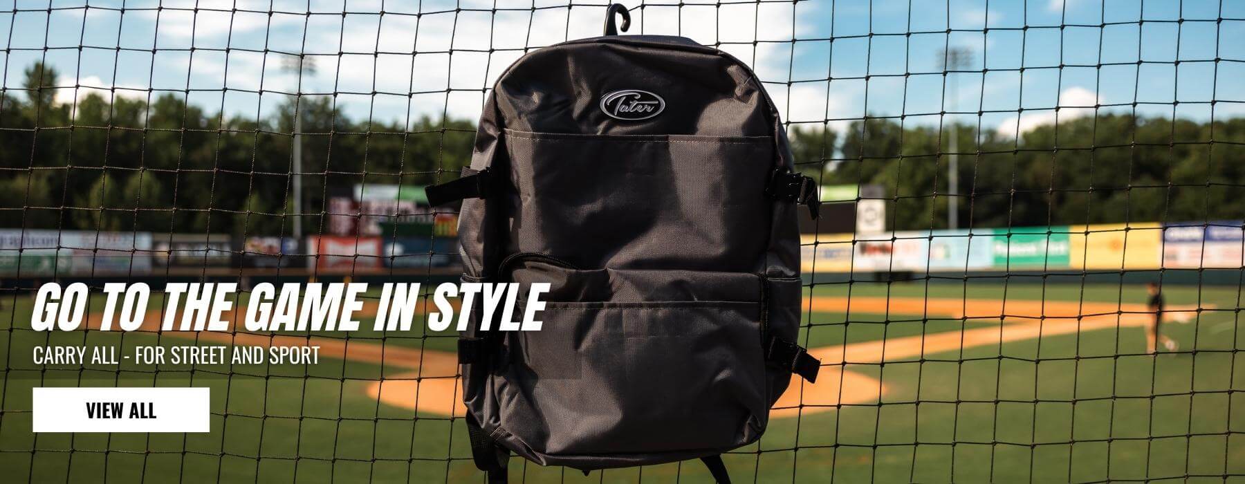 Black baseball backpack bag hanging from frence at the Bowie Stadium. Best for youth baseball players and traveling.