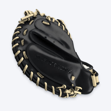 Pinky side of the Tater catcher's mitt with PLAY FOR KEEPS lettering and blonde laces