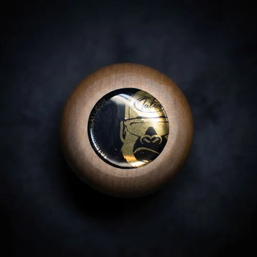 Wood baseball bat knob with gold Tater logo, showcasing premium bat craftsmanship for players.