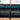 Tater Baseball's top-rated maple wood bat for hitters, standing at home plate in an empty baseball field, a preferred choice for players seeking alternatives to Louisville Slugger.