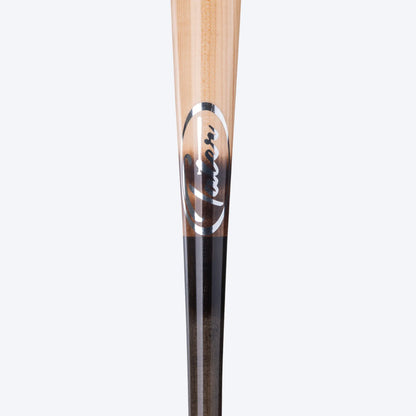 A close-up of the Tater X4 Pro Maple bat's middle, where the natural wood transitions to the black handle. The crisp detail of the wood grain and the clear Tater logo highlight the bat's high quality, favored by high school players.